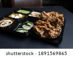 Chur Chur Naan Platter - A combo of Chur Chur naan with Paneer Butter Masala and Dal Makhani served with Mint chutney, Raita and onions