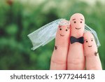 Small photo of Fingers art of Happy couple to get married. Concept of stepson is joy about wedding. Toned image.