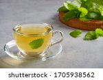 Fresh natural  melissa , lemon balm herbal tea in glass cup.                            