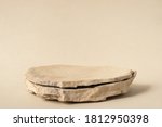 Background for cosmetic products of natural beige color. Stone podium on a white background. Front view.