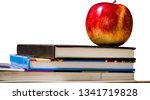 Red apples put on book with...