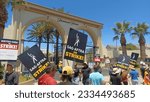 Small photo of Los Angeles - July 19, 2023: SAG AFTRA and WGA striking members walk a picket line in front of Paramount Pictures in Hollywood