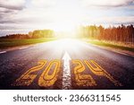 Small photo of New year 2024 or straightforward concept. Text 2024 written on the road of asphalt road at sunset.Concept of planning and challenge, business strategy, opportunity ,hope, new life change.
