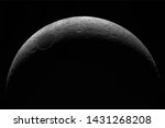 Crescent of a young moon with a large increase. Moon, view through a telescope. The moon with craters. Real photos of space objects through a telescope. Natural background.