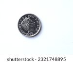 Small photo of the obverse of a 2012 English five pence coin that has been in circulation and has some minor scuffs and scratches, close-up on a white background
