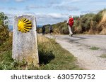 The yellow scallop shell signing the way to santiago de compostela on the st james pilgrimage route