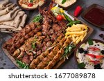 Turkish and Arabic Traditional Ramadan Mix Vali Kebab Plate inside Adana, Urfa, Chicken, Lamb, Liver and Beef on bread 
