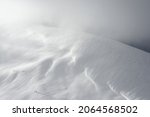 Freeride ski trail on a mountain slope. The mountain range is covered with snow. Winter mountain landscape.