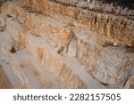 Marble quarry at sunset. Quarry section. Quarry wall in the mountains. Marble quarries. Brown marble quarries. Italian marble quarries.