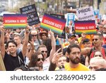 Small photo of San Francisco, CA - April 8, 2023: Participants in the Drag Up Fight Back protest marching from Civic Center to Union Square. Holding sign DISARM HATE in Spanish and English