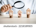 women customer using magnifying glass finding to interest rate home is minimum, affordable alternative price, mortgage home, financial and investment concept. 