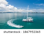 A Large White Sailing Yacht And ...