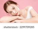 Small photo of Young Asian beauty woman pulled back hair with korean makeup style on face and perfect skin on isolated pink background. Facial treatment, Cosmetology, plastic surgery.