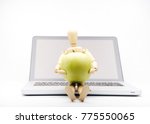 wooden man with computer take apple