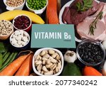 A set of natural products rich in vitamin B6 Pyridoxine. Healthy food concept. Cardboard sign with the inscription. Black background.