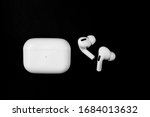 Air Pods Pro. with Wireless Charging Case. New Airpods pro on black background. Airpods Pro. Copy space