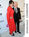 Small photo of West Hollywood, California / USA - February 24 2019: Elton John AIDS Foundation party 2019, 27th annual party, Ruve McDonough and Neal McDonough, red carpet, fashion portraits, viewing oscars party