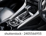 Small photo of automatic transmission shift selector in the car interior. Closeup a manual shift of modern car gear shifter. 4x4 gear shift