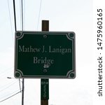 Small photo of Kennebunkport, Maine, United States - August 15, 2018: Sign for the Mathew J. Lanigan Bridge