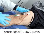 Small photo of Electromyography EMG and Somatosensory Evoked Potential PEV of lower extremities, neurophysiological test applies electrical stimuli near the nerves to explore the rectus femoris muscle