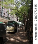 Small photo of View of Forbes Street, Kennedy Town, Hong Kong - 17 Jul 2022: Forbes Street is a street located in Kennedy Town. It is famous of its stonewall trees.