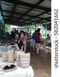 Small photo of Mulu, Sarawak, Malaysia - November 18, 2016: Tourists visit Sarawak native traditional handicrafts market at Penan village