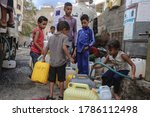 Small photo of Taiz / Yemen - 29 July 2020 : Children fetch water due to the water crisis and the difficult living conditions witnessed by residents of the Taiz city in southern Yemen since the beginning of the war