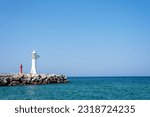 Small photo of East sea breakwater landscape, with blue sky.