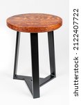 Small photo of Small redwood end table with metal legs on white studio backdrop. Old growth redwood burl.