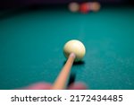 Billiard player's hand with...