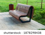 modern park bench and waste bin made of wooden planks