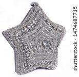 Small photo of A star shape clutch purse made with mettle lace