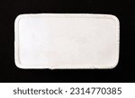Small photo of White rectangular patch with white trim and rounded corners.