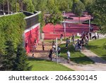 Small photo of Krasnodar, Russia - August 16, 2021: Krasnodar City Park or Galitsky Park. Rest zone. Free resting place for the townspeople. Children play on the playground on a summer sunny day.