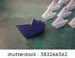 Origami paper ship boats, success leadership, strategy planning development, social media influence marketing, HR recruiter, disruptive innovation, breakthrough business model solutions concept