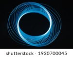 Circular Blue and Wite Neon Ligths on a Black Background