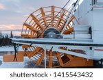 Small photo of The giant orange wheel of a paddle steamer