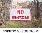 No Trespassing Sign Hanging On...
