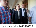 Small photo of Malaysia's former prime minister Najib stepson Riza Shahriz Abdul Aziz or better known as Riza Aziz (C) escorted by his lawyer after get charged by the session court in Kuala Lumpur on July 5, 2019.