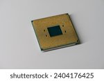 Small photo of Pins of a AMD Ryzen 5 1600 CPU on white table.
