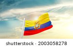Ecuador national flag waving in beautiful clouds.
