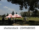 Small photo of Contemporary artwork by world artist Brian Donnelly or KAWS can be seen during an exhibition entitled 'Kaws: Holiday Indonesia' in the Prambanan Temple Complex, Sleman, Yogyakarta on August 19, 2023.