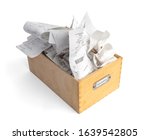 Overfilled box of receipts for filing taxes and deductibles. Wooden storage box with 