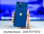Small photo of iPhone 13 in blue. Manhattan, New York, USA September 25, 2021.