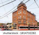 Small photo of Toronto, Canada, September 14, 2020; The renovated Broadview Hotel, famous for once housing Jilly's strip joint, with a Toronto streetcar passing by.