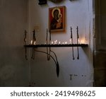 Small photo of Cambridge, United Kingdom - June 26, 2010: Candle holder with burning candles under the Icon of the Virgin Mary and the Christ Child in Great Saint Mary’s church. Cambridge. England
