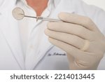 Small photo of A dentist holding an exploratory probe