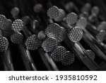 macro closeup bunch of metal silver aluminium nails hardware assorted in black minimal background