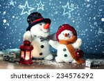 Two Smiling Snowmen  In The...