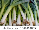 
Fresh juicy raw leeks as a background, closeup. Natural background.